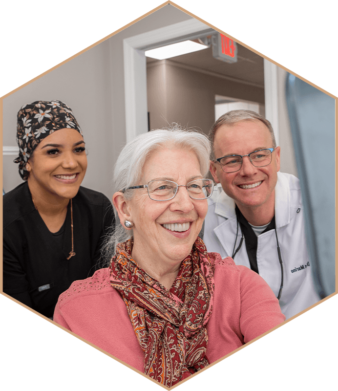 Dr. Marino and a team member smiling with a patient at The Center for Dentistry of Vernon in Vernon Township, New Jersey